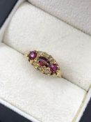 AN ANTIQUE RUBY AND OLD CUT DIAMOND CLUSTER TYPE RING. NO ASSAY MARKS, ASSESSED VARIOUSLY BETWEEN
