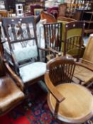 A UNUSUAL VICTORIAN ROCKING CHAIR WITH CARVED WING BACK AND A EDWARDIAN SALON CHAIR
