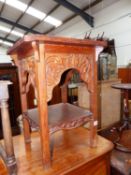 AN ORIENTAL CARVED HARDWOOD URN STAND.