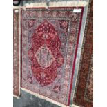 AN ORIENTAL RUG OF PERSIAN DESIGN 194 x 131 cm.