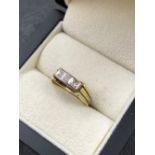 A VINTAGE THREE STONE DIAMOND RING WITH TRIPLE SPLIT SHOULDERS. STAMPED 585, NO ASSAY MARKS,