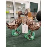 A PAIR OF ANTIQUE MAJOLICA FOLK ART GEESE FIGURES