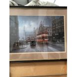 A FRAMED PRINT OF TRAMS IN A CITY DON BRECKON. 40 x 60cms