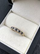 A 9ct HALLMARKED GOLD SAPPHIRE AND DIAMOND HALF ETERNITY RING. FINGER SIZE O. WEIGHT 1.40grms.