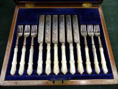 A SET OF HALLMARKED SILVER AND MOTHER OF PEARL DESSERT CUTLERY.