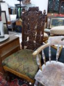 A VICTORIAN CARVED OAK HALL CHAIR