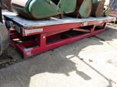A LARGE HYDRAULIC MOTORCYCLE LIFT.
