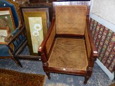 A COLONIAL HARDWOOD BERGERE ARMCHAIR, AND ANOTHER SIMILAR CHAIR