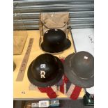 BRITISH AND GERMAN WWII HELMETS, A KHAKI BELT IN A BAG TOGETHER WITH A UNION FLAG