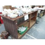 AN ANTIQUE PINE SHOP COUNTER.