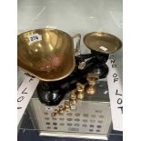 A SET OF LIBRA SCALES WITH BRASS PANS AND WEIGHTS