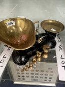 A SET OF LIBRA SCALES WITH BRASS PANS AND WEIGHTS