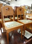 A SET OF FOUR CONTINENTAL ARTS MOVEMENT OAK DINING CHAIRS
