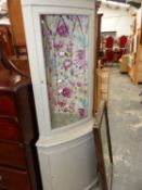 A PAINTED CORNER CABINET.