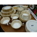 A WEDWOOD GILT DECORATED DINNER SERVICE AND A SET OF FISH CUTLERY