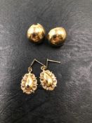 A PAIR OF DOME STUD EARRINGS AND A PAIR OF FACET DROP EARRINGS. NO ASSAY MARKS, ASSESSED AS 9ct