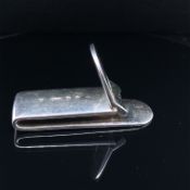 A MILLENNIUM HALLMARKED SILVER MONEY CLIP WITH ENGRAVED KITE AND HINGED FRONT. WEIGHT 44.61grms.