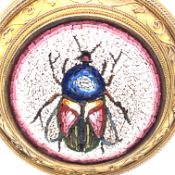 AN ANTIQUE MICRO MOSAIC BROOCH. THE MICRO MOSAIC CENTRE DEPICTING A FLY. THE MOUNT UNHALLMARKED,