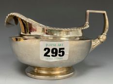 A SILVER CREAM JUG, LONDON 1826, WITH A GADROONED RIM, 234Gms.