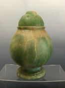 AN UNUSUAL EASTERN STONE JAR WITH PIERCED LID, CARVED AND ETCHED DECOARATION TO THE LID AND UPPER