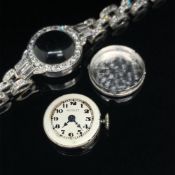 AN ANTIQUE NICOLET LADIES PLATINUM AND DIAMOND COCKTAIL WRIST WATCH. THE INSIDE COVER ENGRAVED 100