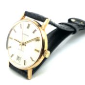 A VINTAGE 9ct HALLMARKED GOLD GARRARD AUTOMATIC WATCH WITH REPLACEMENT LEATHER STRAP. THE SILVER