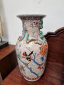A CHINESE PORCELAIN VASE DECORATED WITH BIRDS AND FLOWERS. H 46.5cms.