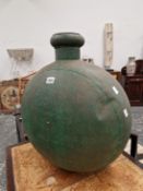 A FLATTENED SPHERICAL GREEN PAINTED METAL FLASK AND COVER