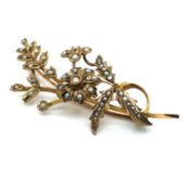 AN ANTIQUE 9ct STAMPED GOLD AND SEED PEARL FLORAL BOUQUET BROOCH. LENGTH 5.8grms. WEIGHT 6.30grms.