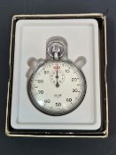 A HEUER SWISS STOP WATCH COMPLETE WITH ORIGINAL BOX. WORKING WITH NO GUARANTEE.