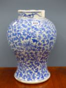 A CHINESE BLUE AND WHITE PORCELAIN BALUSTER JAR PAINTED OVERALL WITH SCROLLING LOTUS. H 36cms.
