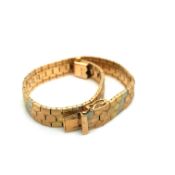 A THREE COLOUR GOLD BRICK STYLE BRACELET. THE CLASP STAMPED 750, ASSESSED AS 18ct GOLD. LENGTH 18.