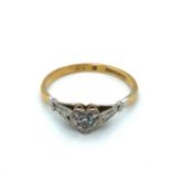 A VINTAGE DIAMOND SET HEART SHAPE MOUNT SOLITAIRE RING. THE SHANK STAMPED 18ct & PLAT, ASSESSED AS