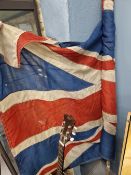 A UNION FLAG MOUNTED ON A POLE, THE TEXTILE APPROXIMATELY. 266 x 126cms.