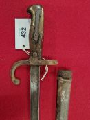 AN 1876 PATTERN FRENCH BAYONET IN AN IRON SCABBARD