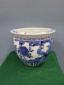 A CHINESE BLUE AND WHITE PLANTER PAINTED WITH BIRDS, PEONIES AND ROCKS. Dia. 37.5cms.