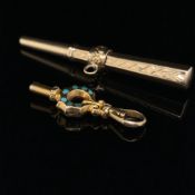 TWO ANTIQUE POCKET WATCH KEYS. THE SMALLER KEY GILDED AND SET WITH TURQUOISE, THE LARGER KEY
