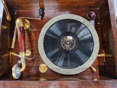 A MAHOGANY CASED VESPER WIND UP GRAMOPHONE WITH GILT FITTINGS, THE TURNTABLE ABOVE DOORS OPENING