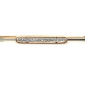 AN ANTIQUE DIAMOND BAR BROOCH. THE 16 OLD CUT DIAMONDS SET IN A PLATINUM FRONT AND A 9-14ct REVERSE.