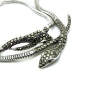 A HALLMARKED SILVER, MARCASITE WITH GREEN PASTE EYES SERPENT NECKLACE AND BRACELET SET. GROSS WEIGHT