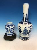 A CHINESE BLUE AND WHITE VASE OF SHOULDERED MALLET SHAPE PAINTED WITH THREE MEN BELOW A STIFF LEAF