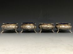 A SET OF FOUR SILVER TRIPOD TUB SALTS WITH BLUE GLASS LINERS BY WILLIAM KER REID, LONDON 1846, THE