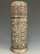 A SILVER SUGAR CASTER BY WOODWARD AND CO., LONDON 1888, THE CYLINDRICAL SHAPE EMBOSSED WITH