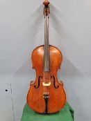 A RED LEATHERETTE CASED CELLO AND BOW, THE BACK OF THE FORMER. 74.5cms