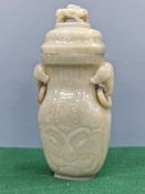 A CHINESE NEPHRITE JADE FLATTENED BALUSTER VASE AND COVER CARVED IN RELIEF WITH DAODIEH, THE