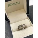 A VINTAGE STONE SET FULL ETERNITY RING. NO ASSAY MARKS ASSESSED AS 9ct GOLD. FINGER SIZE L. 2.