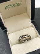 A VINTAGE STONE SET FULL ETERNITY RING. NO ASSAY MARKS ASSESSED AS 9ct GOLD. FINGER SIZE L. 2.