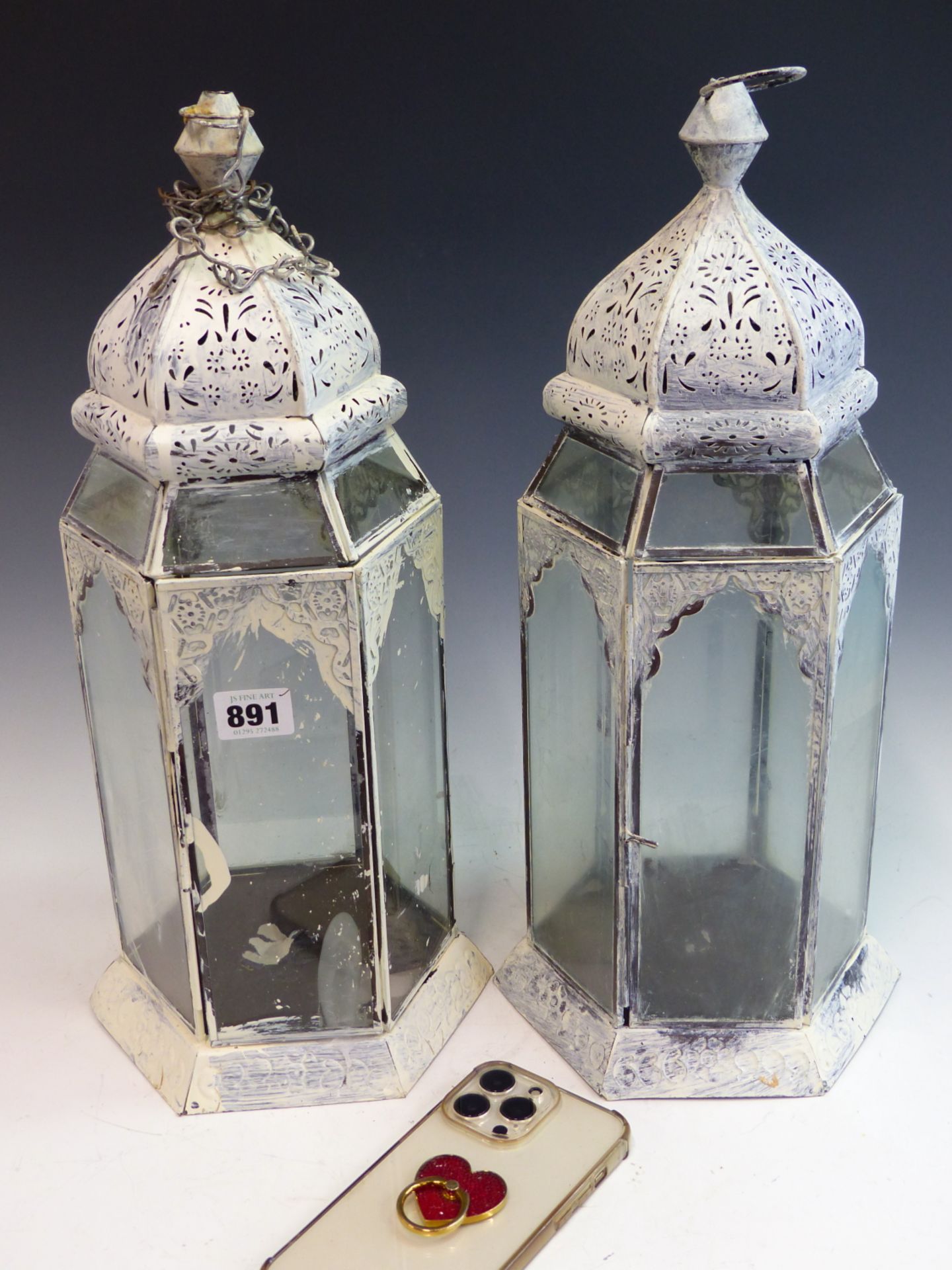 A PAIR OF PAINTED HEXAGONAL PIERCED METAL AND GLASS HANGING CANDLE LANTERNS. - Image 2 of 4