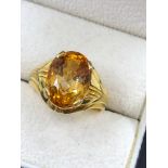 A FINE CITRINE SINGLE STONE RING. THE OVAL CUT STONE IN A RAISED FOUR CLAW SETTING. NO ASSAY