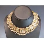 A GOOD QUALITY VINTAGE INDIAN CHOKER NECKLACE OF GRADUATED SILVER GILT AND ENAMEL PANELS EACH WITH